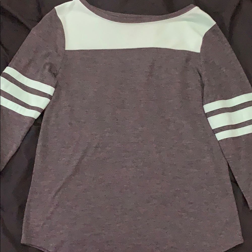 A grey and Turquoise top